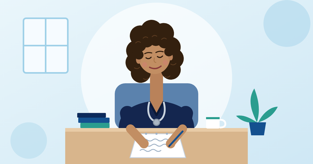 Nurse in navy blue scrubs with a curly bob sitting at a desk and writing notes to prepare for the NMC OSCE 2026